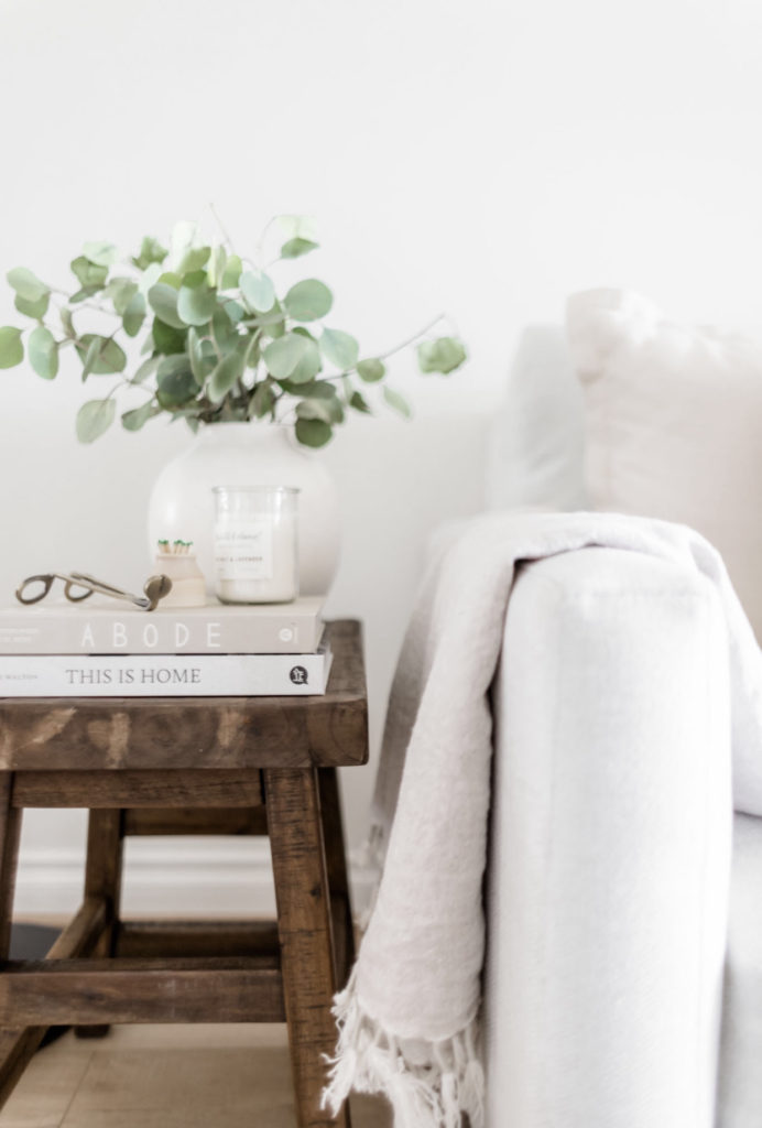 Five Uses For An Accent Stool - Halfway Wholeistic; Click here to see the accent stools on Halfway Wholeistic! Vintage-look accent stools seem to be all the rage these days. I love both the look and versatility of them. Whether you’re looking to add seating, an accent table, or a nightstand, a stool is the perfect addition to nearly any space! Stools for kitchen island with back wood. Stool design wooden modern. Stools for living room extra seating. Kitchen stools with backs modern. Stools in front of fireplace.