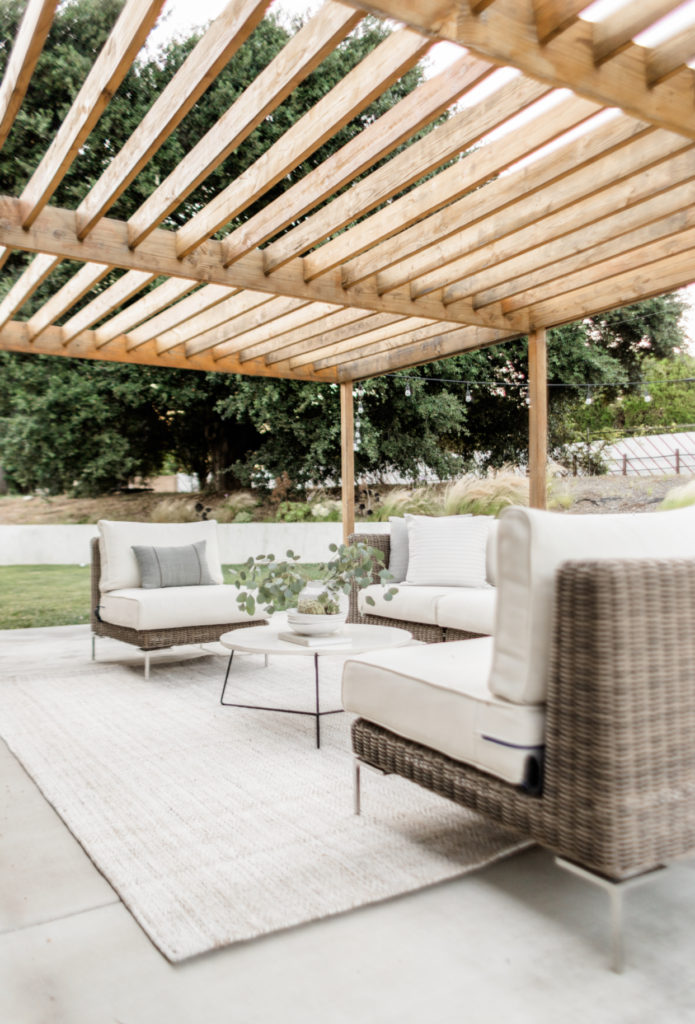 Our Backyard Patio Details - Halfway Wholeistic; Click to see backyard patio on Halfway Wholeistic! We renovated our backyard a few years ago by adding a new stucco wall, wood pergola, concrete patio and fresh landscaping! Backyard landscaping designs layout outdoor living. Backyard patio designs layout landscapes. Backyard patio ideas outdoor areas decks. Backyard patio designs layout landscapes. Patio ideas on a budget backyard wood. Patio ideas decorating back porches. Backyard patio decorating ideas back porches.