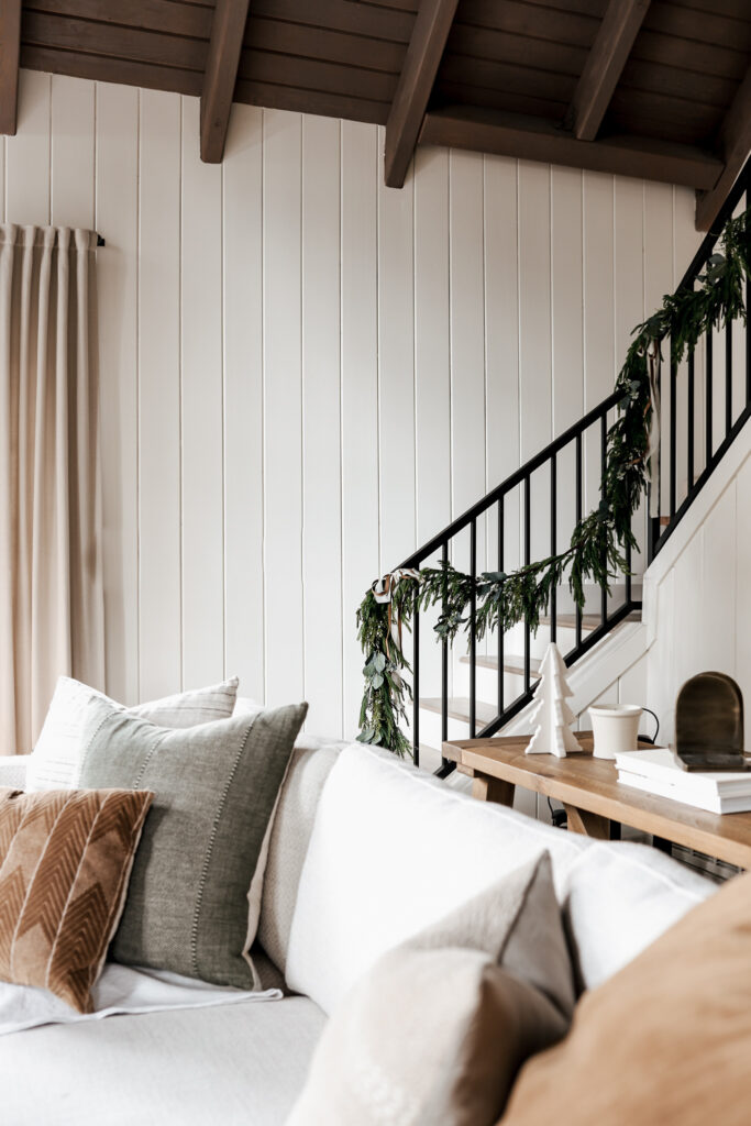 Garland Hanging Hack: How to Hang Garland on Your Staircase Without Hassle or Damage