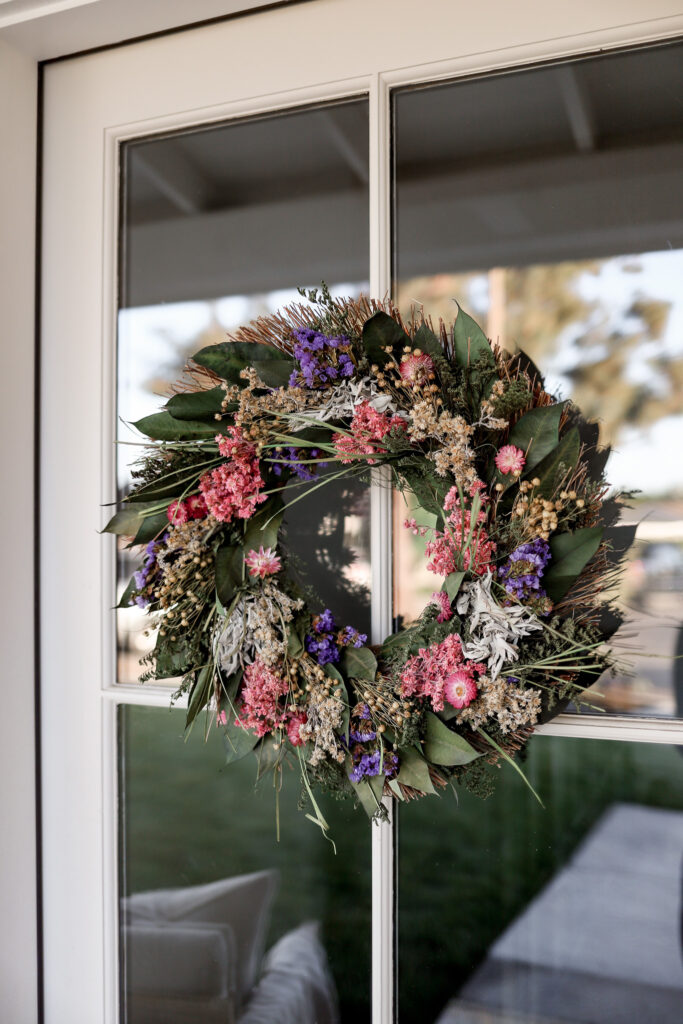 Cozy Spring Front Porch Makeover with Earthy Touches and Floral Charm